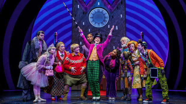 From left, Ben Crawford, Emma Pfaeffle, Kathy Fitzgerald, F. Michael Haynie, Alan H. Green, Christian Borle, Trista Dollison and John Rubin appear in a scene from Roald Dahls Charlie and the Chocolate Factory, coming to the Segerstrom Center for the Arts in June 2019. (Photo by Joan Marcus)