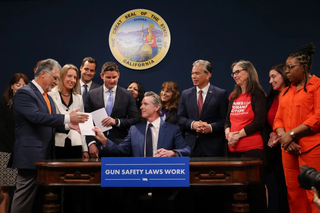 Photo courtesy of the office of Governor Gavin Newsom Governor Newsom Strengthens California’s Nation-Leading Gun Safety Laws” on gov.ca.gov 

