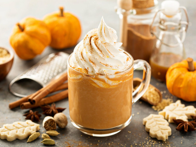 An arrangement of fall themed sweets and a beverage.
